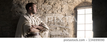 Ancient man at the window 134899090