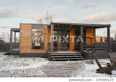 Serene sunset scene showcasing rustic porch with inviting ambiance Serene sunset scene showcasing rustic porch with inviting ambiance 134899124