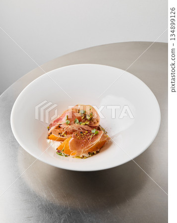 Light savory appetizer, Delicate ham complemented by citrus and herbs 134899126