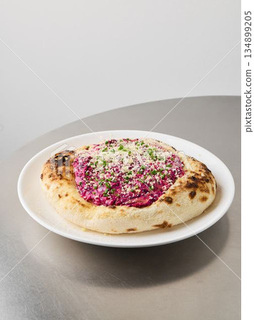 Radiant beet dish served alongside aromatic herbal cheese spread Radiant beet dish served alongside aromatic herbal cheese spread 134899205