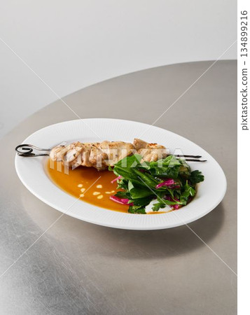 Nourishing skewer complemented by citrus and sesame seeds Nourishing skewer complemented by citrus and sesame seeds 134899216