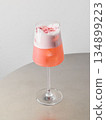 Detailed view of creamy strawberry drink in fashionable glass container 134899223