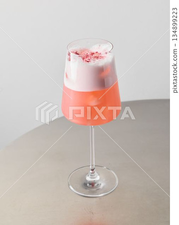Detailed view of creamy strawberry drink in fashionable glass container 134899223