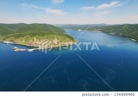 Aerial view of the port of Baikal and the source of the Angara River. Lake Baikal in summer Aerial view of the port of Baikal and the source of the Angara River. Lake Baikal in summer 134899460