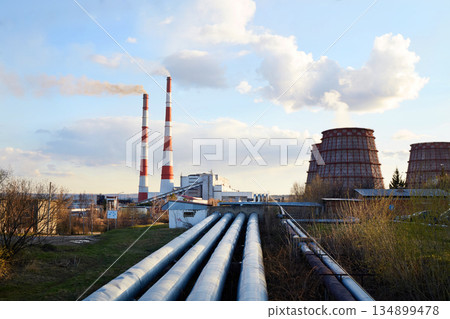Thermal power plant. Industrial zone. Cooling towers,pipeline,the chimney, industrial buildings. 134899478