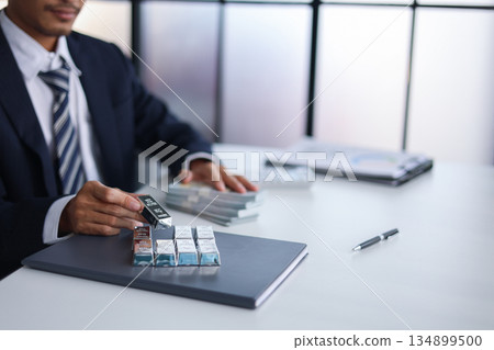 Silver Bars on the table. Businessman invest in trading silver, calculating profit price of buying and selling silver in the market. Silver Bars on the table. Businessman invest in trading silver, calculating profit price of buying and selling silver in the market. 134899500