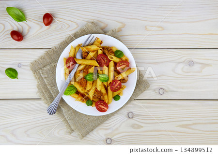 Classic Italian bolognese pasta penne with tomatoes, basil Classic Italian bolognese pasta penne with tomatoes, basil 134899512