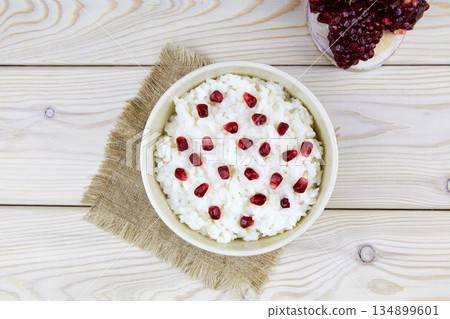 Curd rice in a bowl. A popular dish from South India with rice, pomegranate. 134899601