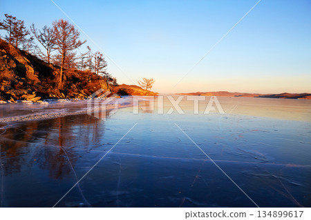 View to the endless expanses of frozen Lake Baikal. Small Sea Strait View to the endless expanses of frozen Lake Baikal. Small Sea Strait 134899617