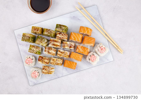 Assorted set of various sushi rolls with tuna, salmon, eel, avocado 134899730