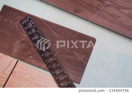 Laying laminate flooring on a floor underlay. Laying laminate flooring on a floor underlay. 134899786