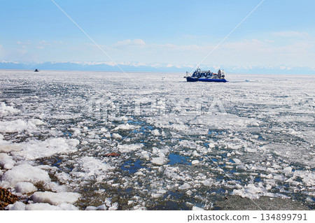 Hovercraft on of the Baikal lake. Lake Baikal in the spring. Hovercraft on of the Baikal lake. Lake Baikal in the spring. 134899791