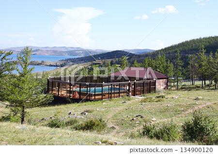 An outdoor swimming pool at a tourist base in a picturesque location An outdoor swimming pool at a tourist base in a picturesque location 134900120