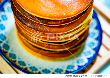 Freshly tasty stack of pancakes on the plate. Delicious homemade breakfast Freshly tasty stack of pancakes on the plate. Delicious homemade breakfast 134900366