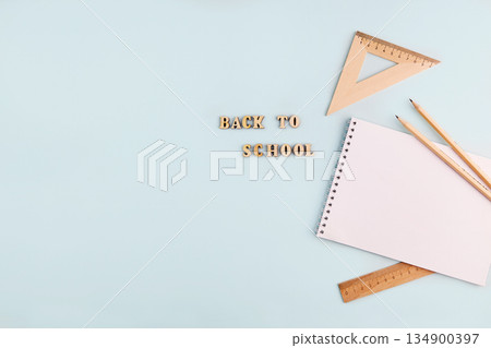 School supplies: an empty notebook, wooden pencils and rulers. School supplies: an empty notebook, wooden pencils and rulers. 134900397