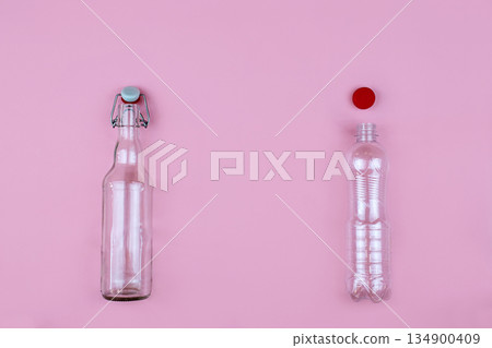 Plastic and glass bottle on a pink background. Plastic free, zero weste concept. 134900409