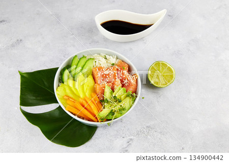 Salmon poke bowl with avocado, salmon, carrot, cucumber Salmon poke bowl with avocado, salmon, carrot, cucumber 134900442