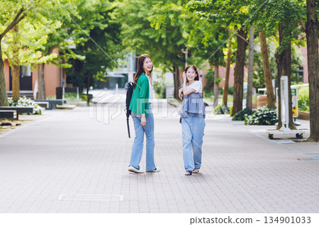 Two women walking on a university campus Two women walking on a university campus 134901033