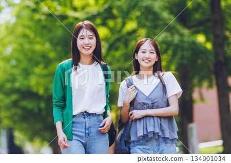 Female college student walking on campus Female college student walking on campus 134901034
