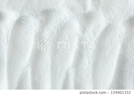 Soda powder sodium bicarbonate surface. Abstract white background. White texture with wavy patterns top view 134901332