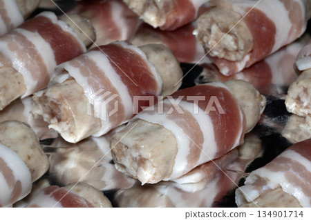 Close up of sausages and bacon ready to be cooked for dinner Close up of sausages and bacon ready to be cooked for dinner 134901714