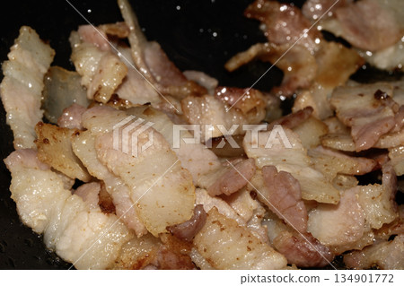 Close up of frying fried bacon pieces ready to be eaten Close up of frying fried bacon pieces ready to be eaten 134901772