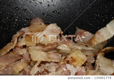 Close up of frying fried bacon pieces ready to be eaten Close up of frying fried bacon pieces ready to be eaten 134901774