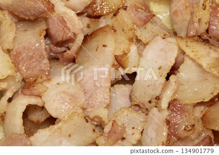 Close up of frying fried bacon pieces ready to be eaten Close up of frying fried bacon pieces ready to be eaten 134901779