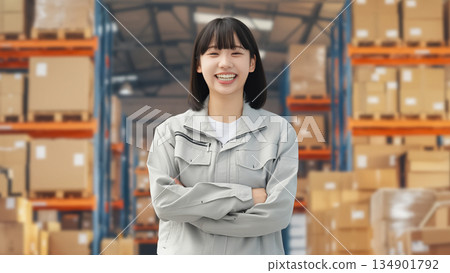 A young female worker working at a logistics center 134901792