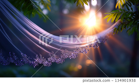 Elegant wedding veil with floral embroidery and sunlight streaming through lush green foliage for a magical and romantic atmosphere 134901938