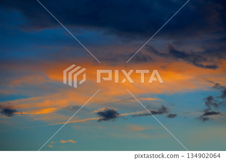 Sunset orange clouds in a blue sky 134902064