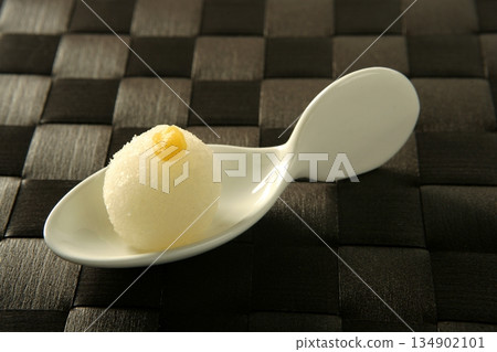Pastries over spoon Pastries over spoon 134902101