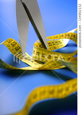 taylor yellow centimeter tape meter and scissors cutting taylor yellow centimeter tape meter and scissors cutting 134902132