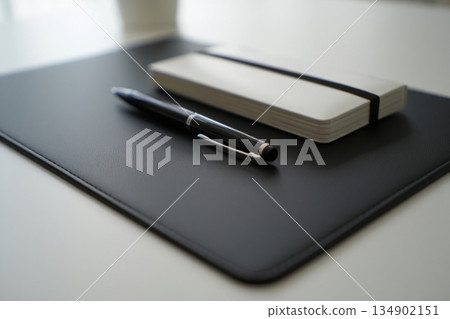 close up of notebook on desk at office 134902151