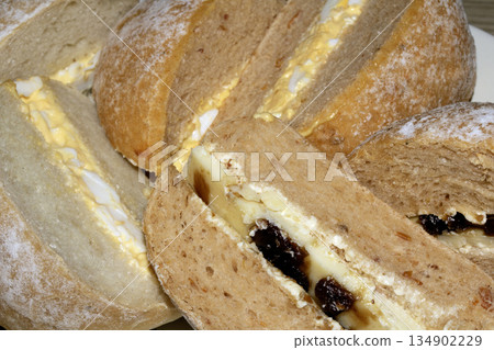Close up of sandwich filled bread rolls cut in half 134902229