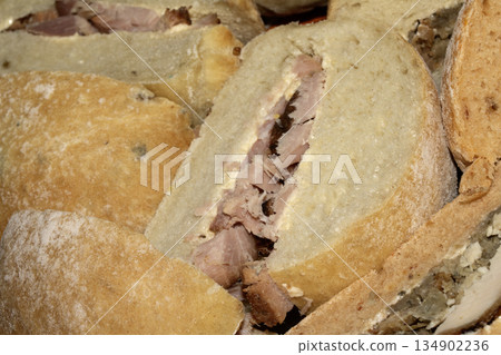 Close up of sandwich filled bread rolls cut in half 134902236