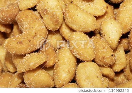 Close up of salt and sugared cashew nuts and peanuts 134902243