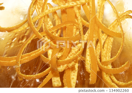 Close up of orange peel slices thin grated fruit Close up of orange peel slices thin grated fruit 134902260