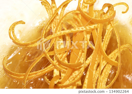 Close up of orange peel slices thin grated fruit Close up of orange peel slices thin grated fruit 134902264