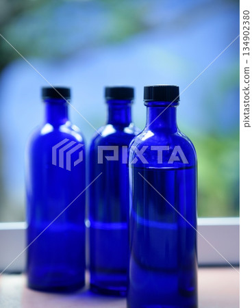 Three Blue glass body oil bottles Three Blue glass body oil bottles 134902380