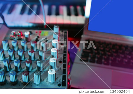Audio mixer music desk under colorful lights Audio mixer music desk under colorful lights 134902404