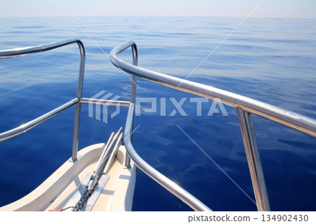 boat sailing blue calm ocean sea bow railing boat sailing blue calm ocean sea bow railing 134902430