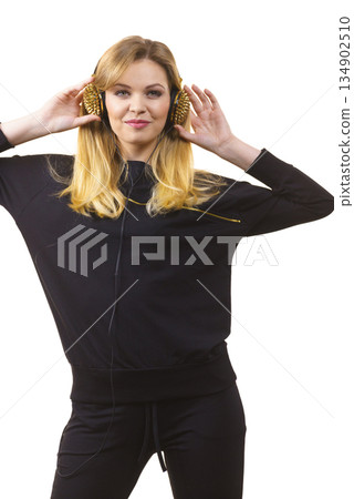 Teenage woman wearing headphones 134902510