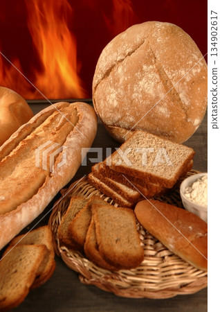 Bread still life with varied shapes and bakery fire Bread still life with varied shapes and bakery fire 134902617