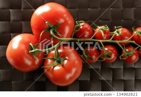 Red big and little cherry tomatoes branch Red big and little cherry tomatoes branch 134902621
