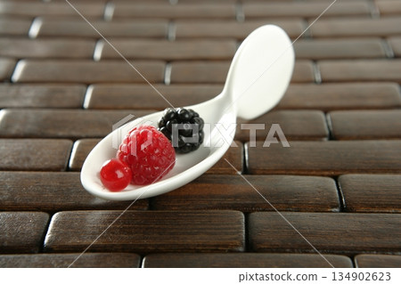 Berries in a white spoon Berries in a white spoon 134902623