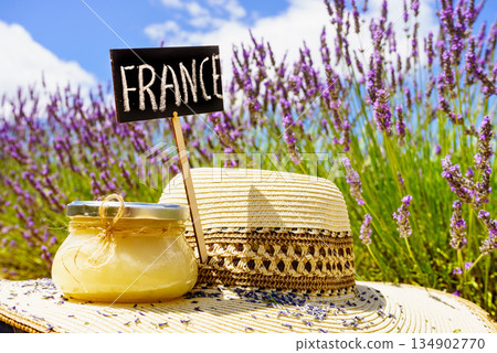 Jar with honey at lavender field. Holidays in France. Jar with honey at lavender field. Holidays in France. 134902770