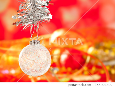 Christmas tinsel snow crystal bauble on red 134902800