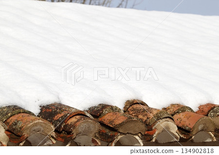 aged clay roof tiles snowed under snow architecture detail 134902818