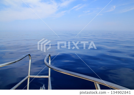 boat sailing blue calm ocean sea bow railing boat sailing blue calm ocean sea bow railing 134902841